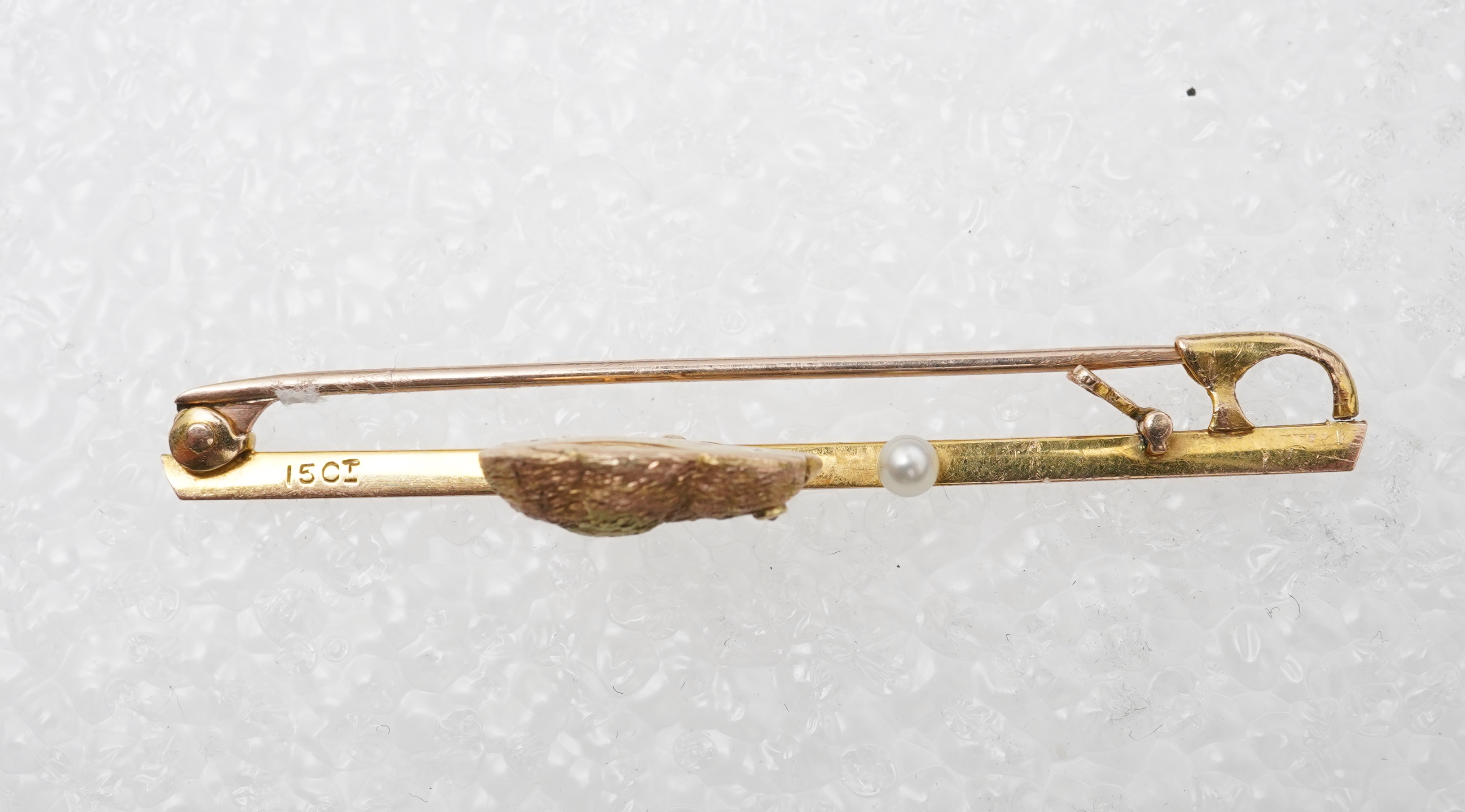 A gold and seed pearl novelty bar brooch, circa 1900